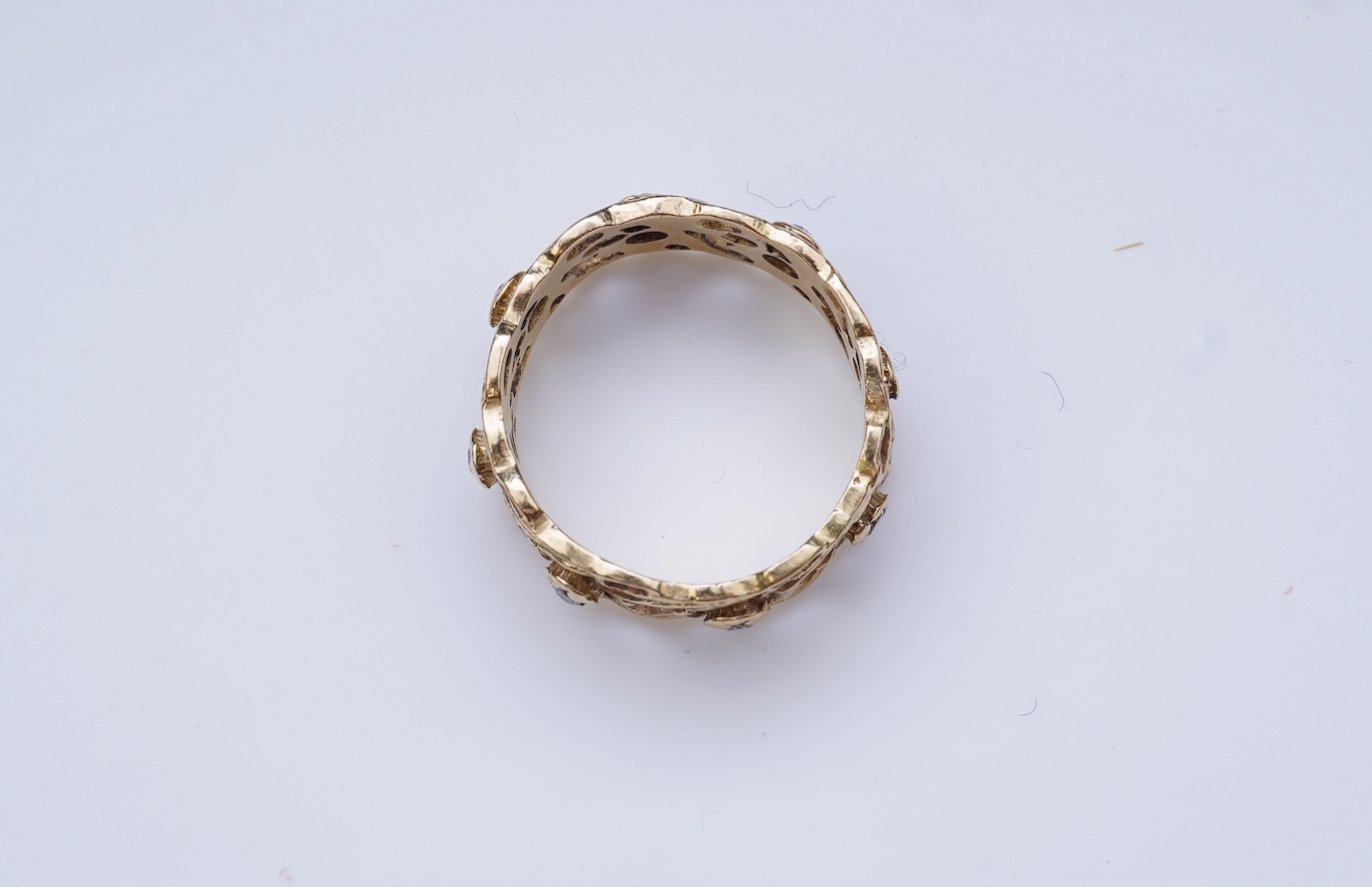 A gold and diamond eternity ring